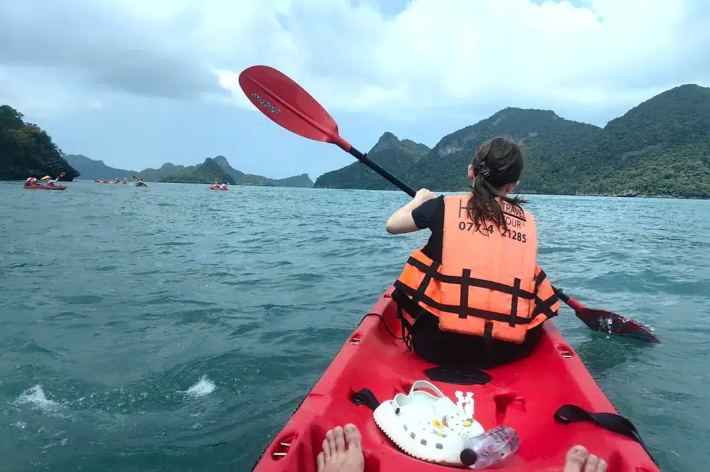 Paddling a red kayak towards the islands
