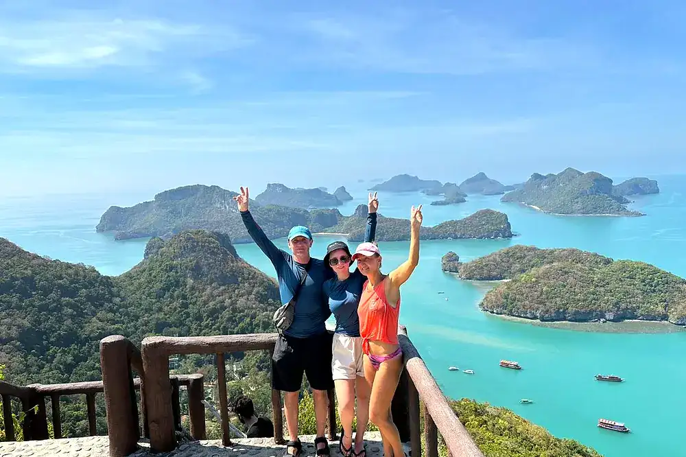 Group of travellers at the top viewpoint above the islands