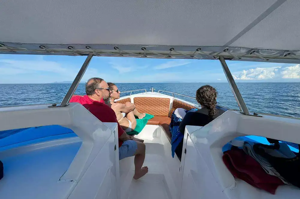 Guests relaxing on the bow of the speedboat