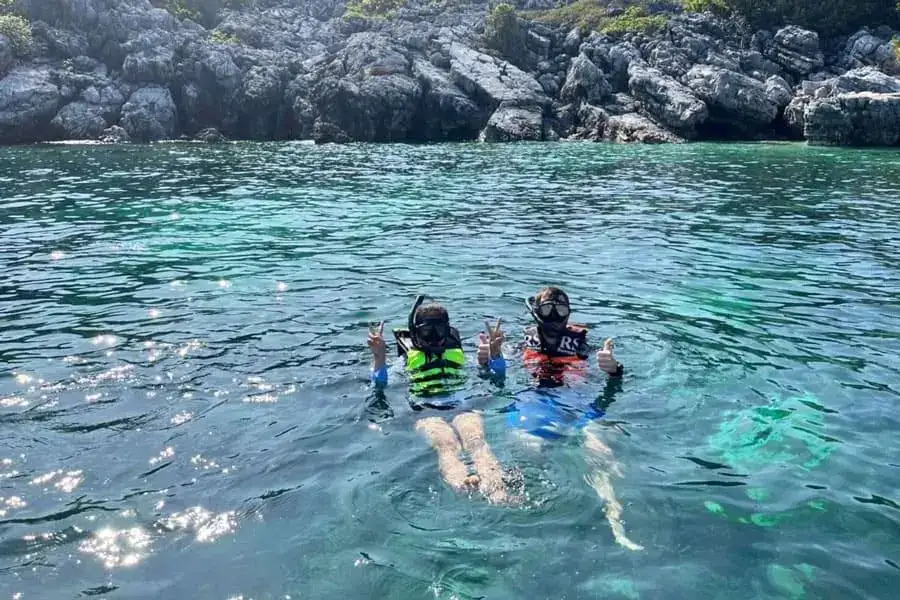 Snorkeling over rocks in Ang Thong