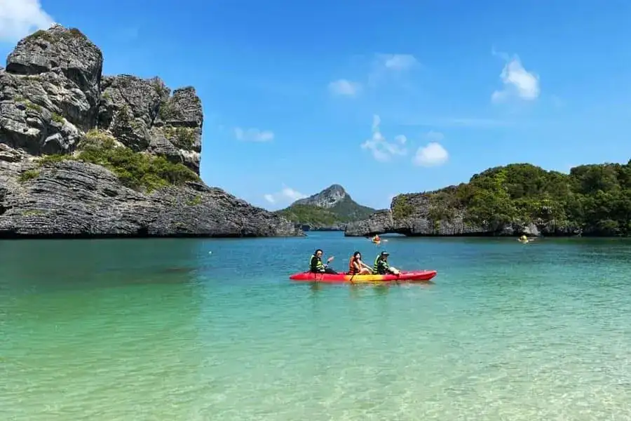 Kayakers in front of the cliffs of Koh Sam Sao