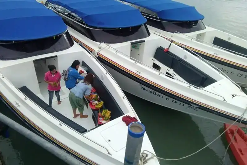 Boarding a group speedboat at the pier